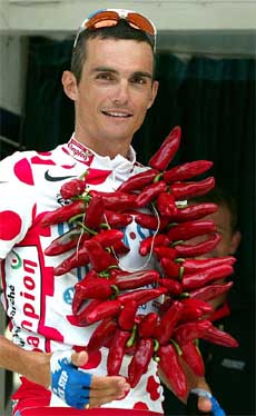 Quick Step's French rider Richard Virenque wears a garland of red chilies