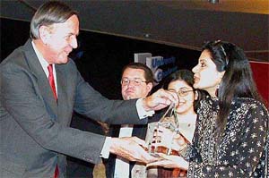British High Commissioner to India Rob Yang presents a trophy