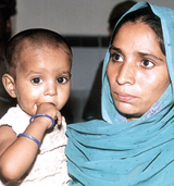 One-and-a-half-year-old Tannu with his mother after being rescued from a hospital in Gurgaon.