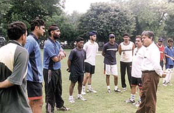 Oil and Natural Gas Corporation Executive Director Dr A K Balyan and sports officer Sunil Khanna interacting with the cricket players attending a coaching camp at the National Stadium on Thursday morning.