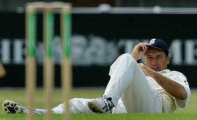England skipper Nasser Hussain lies on the ground