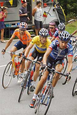 US Postal teamleader Lance Armstrong rides alongside teammate Manuel Beltran of Spain