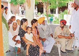 Family members of Harmel Singh narrate the dacoity incident which took place at their house at Palheri village in Kharar 