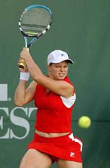 Kim Clijsters of Belgium returns to Amber Liu 