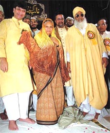 Delhi Chief Minister Sheila Dikshit with Waqf Board Chairman Haroon Yusuf being honoured by the president of Imam Organisation, Maulana Jamil Ilyasi at a function in the Capital on Saturday