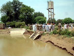 The floor and side wall of a storage tank of water works of Haku wala village of Muktsar district which caved in due to heavy rain