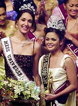 Miss Universe 2003 Amelia Vega of Dominican Republic, left, and newly crowned Miss Indonesia Dian Krishna