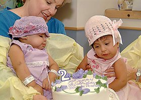 Maria de Jesus Quiej Alvarez looks at a birthday cake