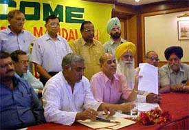 Mr Amrit Lal Jain, president of the Punjab Pradesh Beopar Mandal, shows the list of objections raised against the exim form 