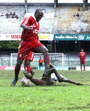 JCT's Musa Aliu tries to cross a Charchill Brothers defender 