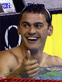 Russia's Alexander Popov celebrates after winning the gold medal in the 50m freestyle race