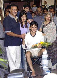 Bollywood actor Vivek Oberoi, surrounded by his family members, comes out of Hinduja Hospital after being discharged in Mumbai