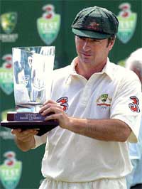 Australian captain Steve Waugh holds the winner's trophy 