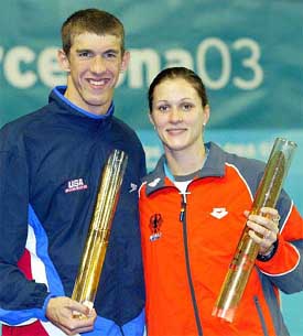 Michael Phelps from the US and Germany's Hannah Stockbaur strike a pose 