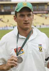South Africa�s cricket captain Graeme Smith shows his �player of the match� medal