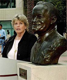 Linda Hope addresses a news conference next to a bust of her father Bob Hope