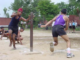 A player of Government High School, Talwandi Khurd, tries to catch a KVM player during the kho-kho final match of u-17 