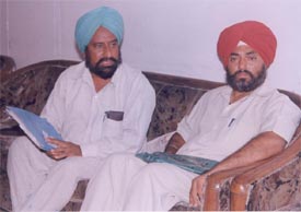 Mr Jagraj Singh Gill and Mr Devinder Singh, both �clients� of the Ludhiana Improvement Trust, wait for the chairman in his office