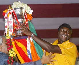 East Bengal captain Suley Musah shows the ASEAN Cup to the 10,000 strong crowd
