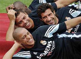 Real Madrid�s Ronaldo, Luis Figo and Roberto Carlos share a light moment