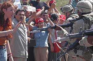 Unemployed Iraqis demand jobs during a protest in front of the Coalition Provisional Authority headquarters