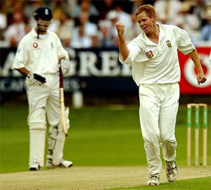 South African pacer Shaun Pollock celebrates the dismissal of England's Mark Butcher 