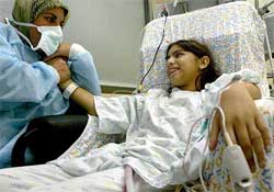 Najah Kawthar with her 14-year-old daughter Zuabi