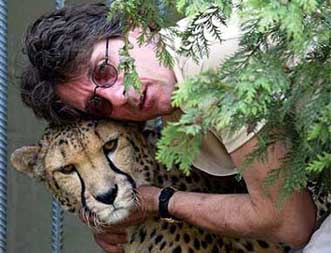 Dr Rainer Zangger, owner of Egerkinden Jurassic Park in Switzerland, hugs his eight-year-old male cheetah Norse 