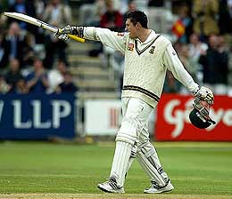 South Africa captain Greame Smith points to his team-mates after scoring a double century on the scond day of the second Test against England at Lord's on Friday. 