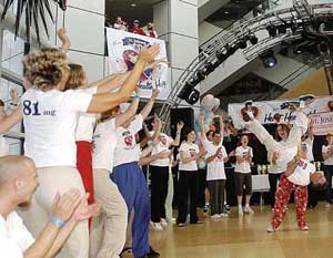 Some of the 41 dancers cheer as Jan Hurwitz spins her husband and dance partner, Dick, to celebrate being part of what they hope is a world record 51-hour dance marathon 