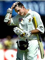 South African captain Graeme Smith leaves the field after being bowled out for 259