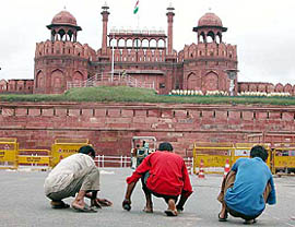 Workers of the Civil Department busy cleaning the surroundings of the Red Fort