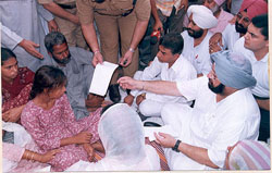 Punjab Chief Minister Capt. Amarinder Singh consoles the family of Gurmeet Singh 