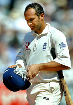 England's Mark Butcher walks off after being dismissed for 70 runs