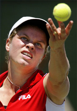 Belgium's Kim Clijsters serves to opponent Lindsay Davenport of the US 