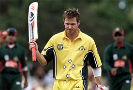 Australian batsman Damien Martyn raises his bat after scoring an unbeaten 92 runs off just 51 balls