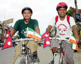 Nepali youths Prem Prasad and Arjun Sharma Bhattarai, who have travelled through south-east Asia, including Hong Kong and China, arrive at Jalandhar 