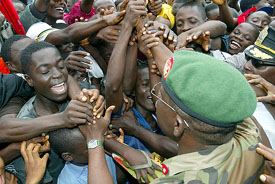 Nigerian Colonel Emeka Onwuama is greeted by relieved Liberians