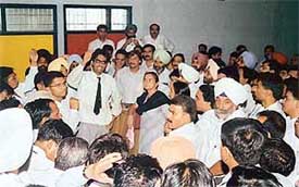 Lawyers raise slogans against the District Bar Association president at a stormy General House meeting in the District Courts in Ludhiana
