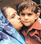 Deepak in the safe hands of his mother in the Capital on Tuesday. 
