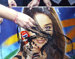 BJP activists deface an advertisement poster of Pepsi, featuring Bollywood actress Kareena Kapoor