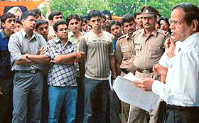 Prof K.N. Pathak, Vice-Chancellor of Panjab University, makes a point to the agitating students of the University Institute of Engineering and Technology (UIET), in Chandigarh on Wednesday. 