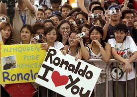 Real Madrid fans in Hong Kong wait for their favourite team to arrive at the Hong Kong International airport