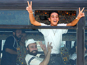 Palestinian prisoners flash victory signs from a bus after being released from the Megiddo prison in northern Israel 
