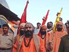 Sadhus carry the Chharri Mubarak, a holy mace of Lord Shiva, in Srinagar 