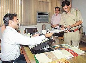 Paonta Sahib SHO Khazan Singh receives replies to queries on allegations of causing death of cows from the Municipal Joint Commissioner, Mr Kulwant Singh Kalsan, in Chandigarh on Friday. 