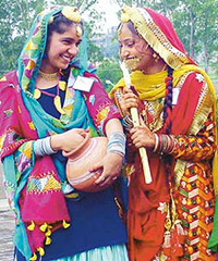 Participants of Miss Teej contest share some light moments as they wait for their turn outside the college auditorium at the Government Polytechnic for women, Ludhiana, on Friday.