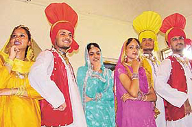Students of Government College present bhangra and jhumar at a function held on Friday. 