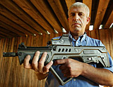 Moti Rosen, Vice- President of the Israeli Military Industries, displays the Tavor, a new domestically- produced assault rifle slated to replace the US made M-16 in the Israeli Defence Forces, in Ramat Ha'Sharon near Tel Aviv Friday. Tavor is designed specially for urban warfare.