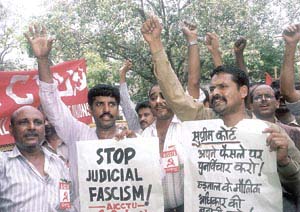 Activists of the All-India Central Council of Trade Unions protesting against the Supreme Court ruling on the right of government employees to strike in the Capital on Saturday. 